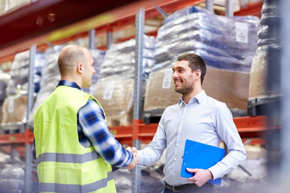 fpdl.in_wholesale-logistic-people-export-concept-manual-worker-businessmen-with-clipboard-shaking-hands-making-deal-warehouse_380164-123192_large.jpg